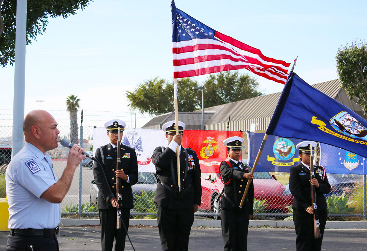 OCTA Coach Operator Adrian Tavera sings the National Anthem during the 2023 OCTA Veterans Day recognition event in Garden Grove