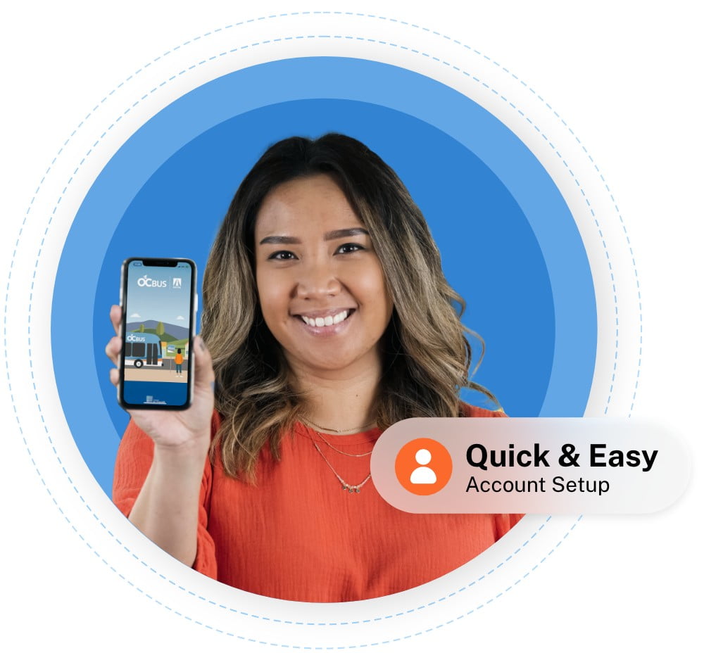 A smiling woman holds up a phone with the OC Bus App on the screen